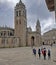 Group of young pilgrims walk to the romanic cathedral of lugo on the way to santiago. Jacobean holy year 2021