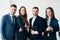 Group of young and smiling business people in modern office