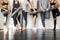 Group of young sporty people standing at wall, close up