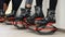 Group of young sporty women doing fitnes exercises with kangoo jumps shoes in a gym.