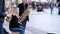 Group of young street musicians play the saxophones and drums modern music on a tourist center of old city.