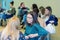 Group of young university female students having a group discussion sitting together on a circle of chairs