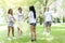 Group of young volunteers picking up litter in the park