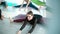 Group of young women practicing yoga, sitting in Wide-Angle Forward Bend pose