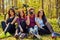 Groupe of people relaxing after bicycle ride in a forest.