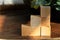 Groupped wooden square blocks on dark wooden table