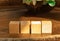 Groupped wooden square blocks on dark wooden table