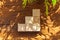 Groupped wooden square blocks on dark wooden table