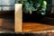 Groupped wooden square blocks on dark wooden table