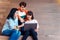 Groups of asian teenage students using laptop computer studying