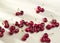 Groups of cherries on a white background in sunny light