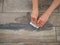 Grouting between ceramic tiles. The girl works with a spatula. Repair in the room