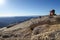 Groveland, California - United States - July 24, 2014: Man searches with binoculars after hiking to top of Mt. Hoffman.