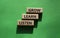 Grow Learn Listen symbol. Concept words Grow Learn Listen on wooden blocks. Beautiful green background. Business and Grow Learn