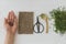 Growing microgreens at home. Flax sprouts, linen mat, spoon, hand with seeds, scissors. Top view