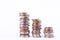 Growing money graph on a three row of coin and pile of bath coins stack on white background finance business isolated