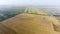 Growing rice on flooded fields. Ripe rice in the field, the beginning of harvesting. A bird\'s-eye view.