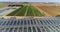 Growing vegetables in greenhouses. Large modern greenhouse. Flight over a large greenhouse. greenhouses aerial view