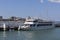 Growth dolls are dancing on the upper deck of the ship Salamander inviting passengers on a sea voyage. Central pier Gelendzhik Bay