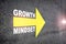 Growth mindset with yellow arrow marking on road surface
