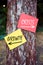 Growth versus crisis words written on papers on a tree with arrow signs. Dilemma or choice between growth decision or crisis in