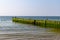 Groyne with seagulls on the beach near Kampen