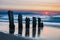 Groynes on shore of the Baltic Sea in Kuehlungsborn, Germany