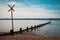 Groynes stretch out into a the sea at Weston Shore, Southampton