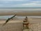 Groynes on Winchelsea Beach to stop the erosion by the tides and weather. Pebble beach with sea and sky landscape - East Sussex UK