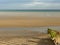 Groynes on Winchelsea Beach to stop the erosion by the tides and weather. Pebble beach with sea and sky landscape - East Sussex UK