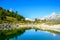 Gruensee (Green lake) with view to Matterhorn mountain - trekking in the mountains near Zermatt in Switzerland