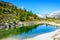 Gruensee (Green lake) with view to Matterhorn mountain - trekking in the mountains near Zermatt in Switzerland