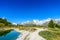 Gruensee (Green lake) with view to Matterhorn mountain - trekking in the mountains near Zermatt in Switzerland