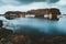 Grundarfjordur, Iceland - 03 January 2019: Harbor with motionless boats during the twilight of the afternoon, Kirkjufell