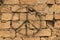Grunge background of rustic bricks with sloppy mortar with spray painted peace sign and an electric wire running diagonally
