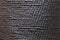 Grunge black background. Textured surface. Symmetrical rough convex elements