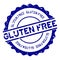 Grunge blue gluten free word round rubber stamp on white background