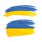 Grunge brush stroke with Ukraine national flag on white