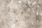 Grunge concrete texture. Beige asphalt road top view photo. Distressed and obsolete background texture.