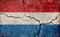 Grunge country flag illustration cracked concrete background / Netherlands