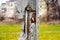 grunge cracked concrete column with exposed rusty steel reinforcing bars. soft blurred background