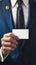 Grunge elegance Close up of a businessman holding a blank card