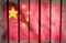 Grunge filtered China national flag on wood.