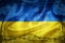 Grunge flag of Ukraine surrounded by barb wire illustration
