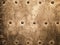 Grunge gold brown metal plate rivets screws background texture