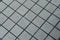 Grunge gray ceramic tile floor