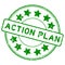 Grunge green action plan word with star icon round rubber stamp on white background