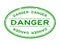 Grunge green danger word oval rubber stamp on white background