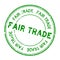 Grunge green fair trade word round rubber stamp on white background