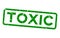 Grunge green toxic word square rubber stamp on white background